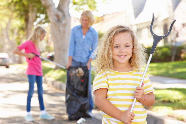 Family volunteer together doing a community service project.