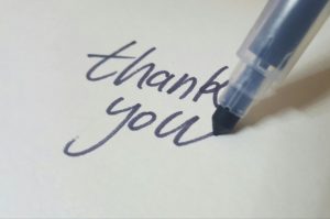 Writing a thank you letter.
