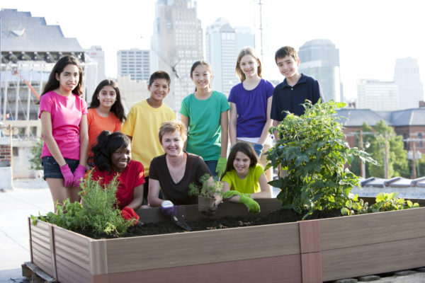 Youth Squad® Volunteers Plant Rooftop Garden