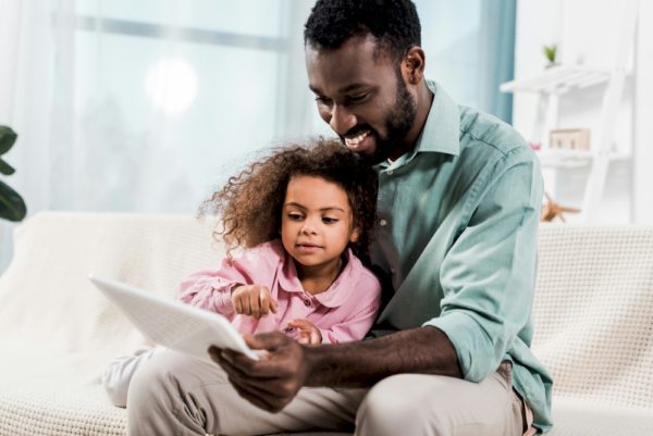 Dad and daughter learning together.