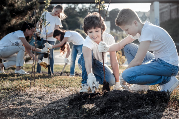 Friends doing volunteer work together.