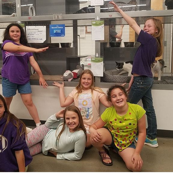 Girl Scouts volunteer with the ASACP